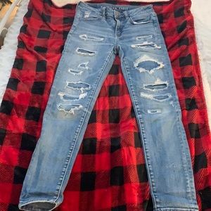 American eagle super stretch hole denim jeans. Size 2. Mild wear good condition